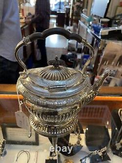 Victorian style tea kettle on stand. Silver plate